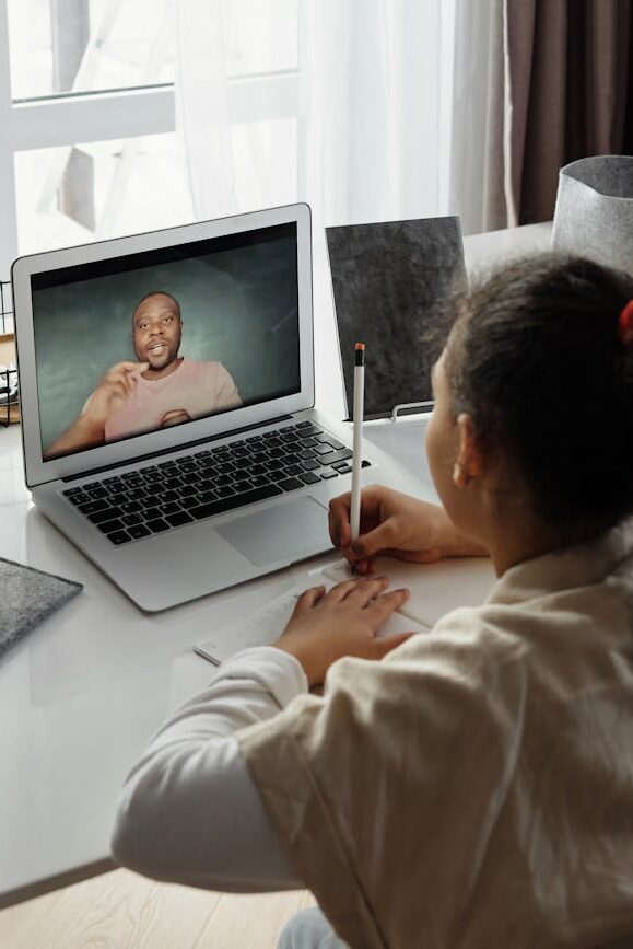 little girl taking online classes